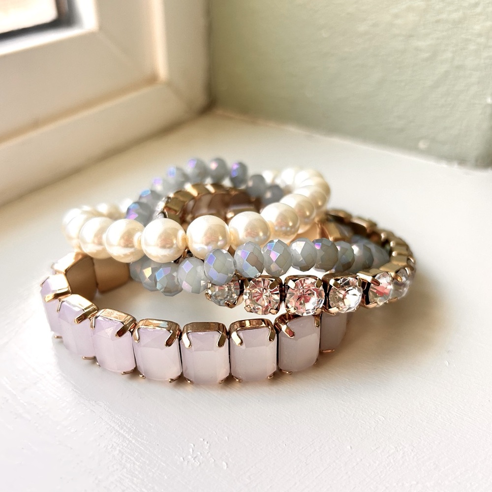 Stack of jeweled bracelets